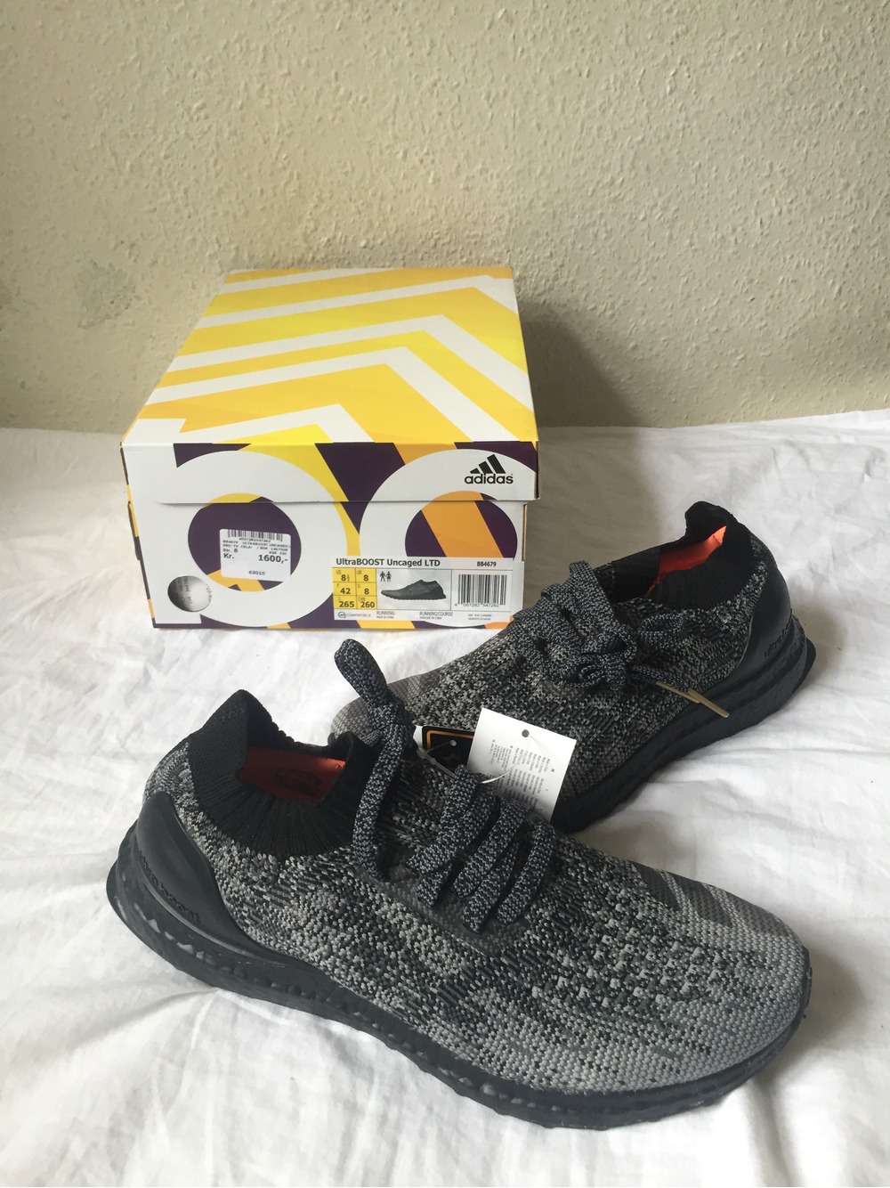 Adidas nmd r1 shoe palace black and gold eh2749