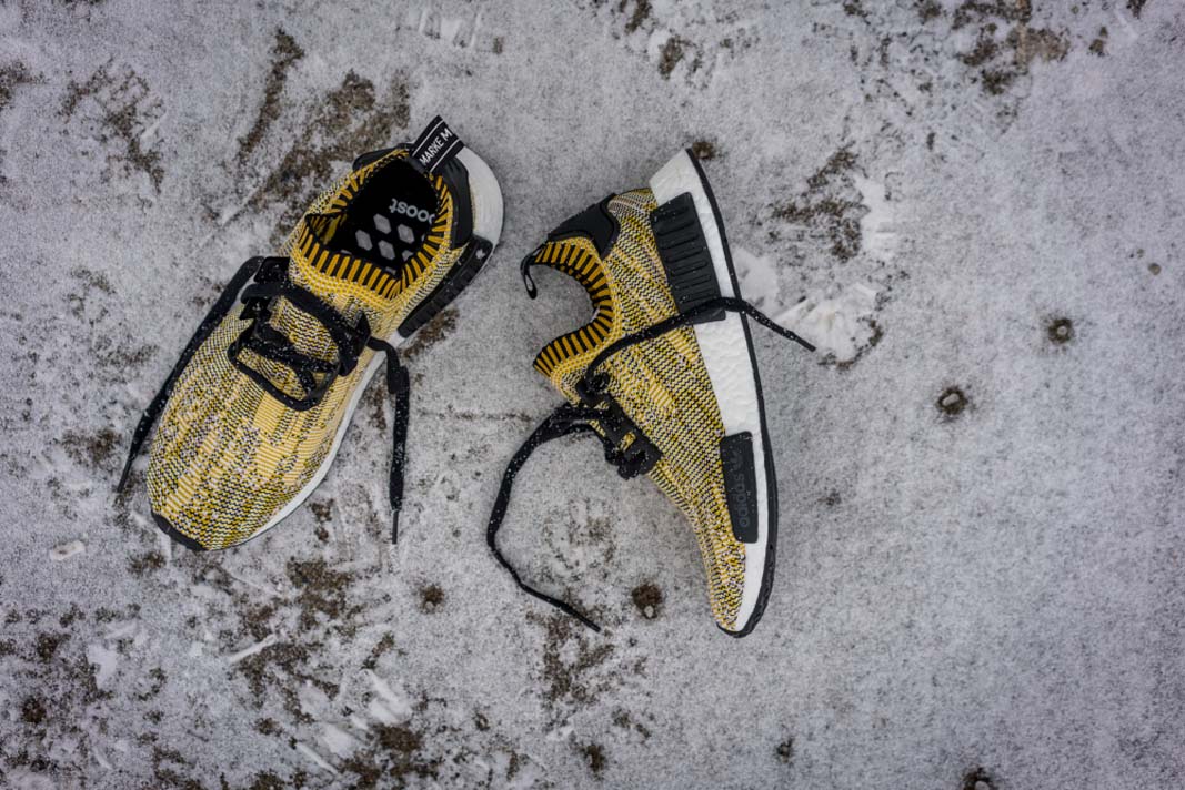 yellow and black nmds